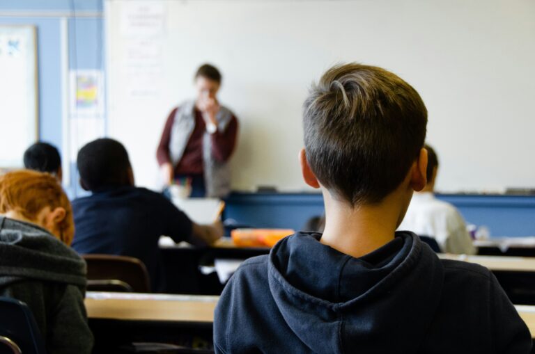Image of student sitting in a classroom (Unsplash/Taylor Flowe)